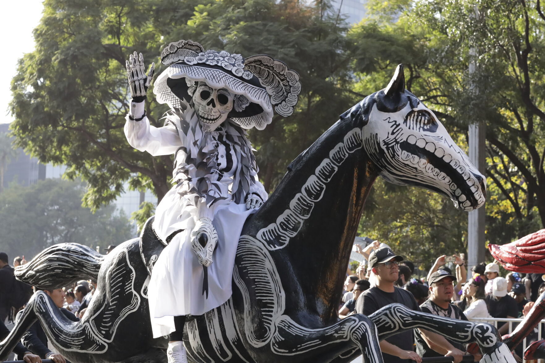 Skeleton marching bands and dancers in butterfly skirts join in Mexico City’s Day of the Dead parade