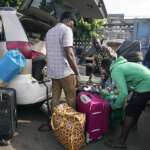 Nigeria slashes transport fees during the holidays to ease some of…