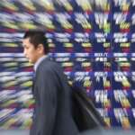 Japanese shares rise as automakers gain on weaker yen