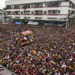 Over one million barefoot devotees flock to feverish Christ icon parade in Philippines
